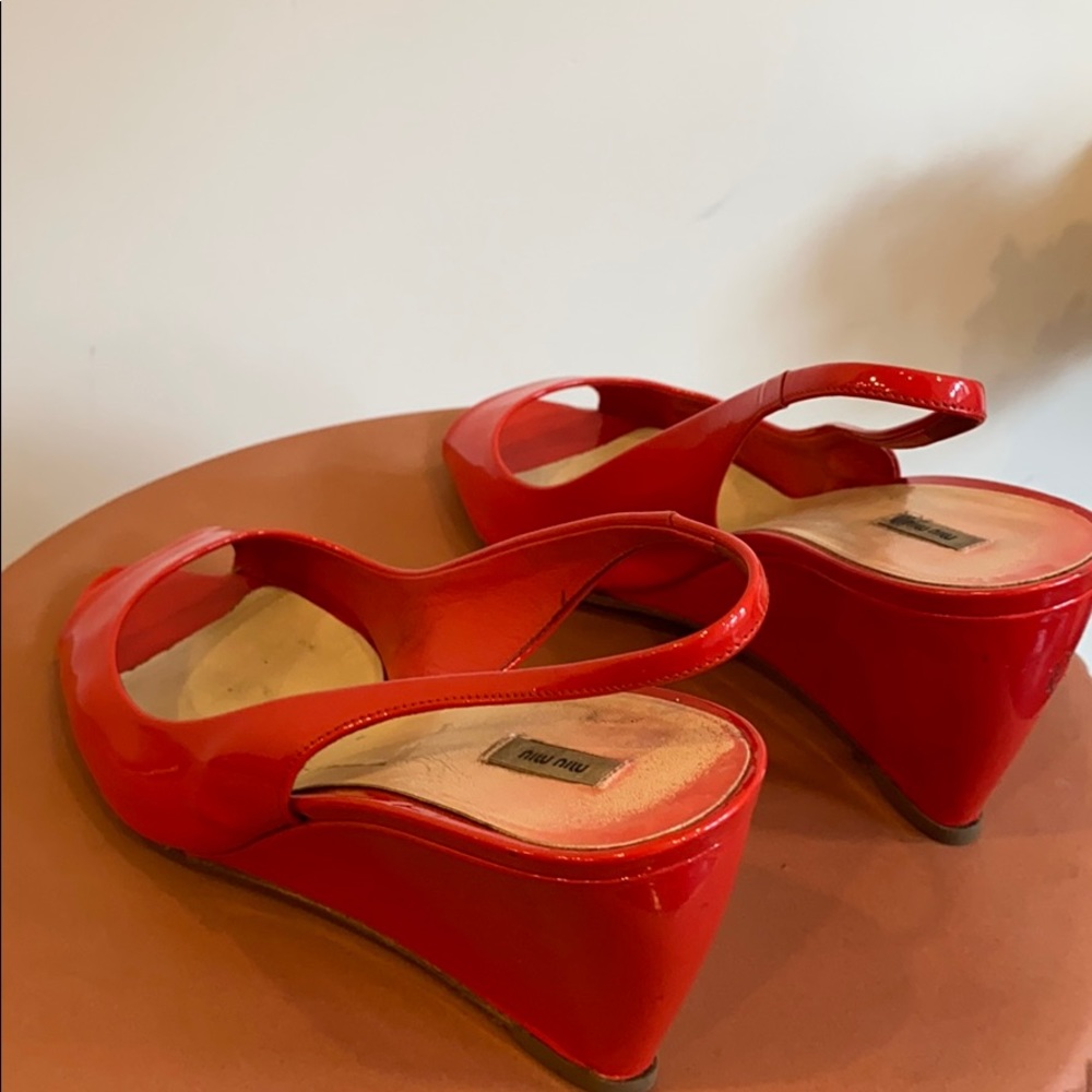 Miu Miu red patent leather pumps